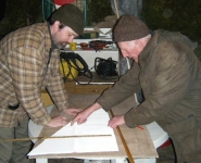Stephen and Loughie work on the cutting of the sail material. Photo: Marianne Green